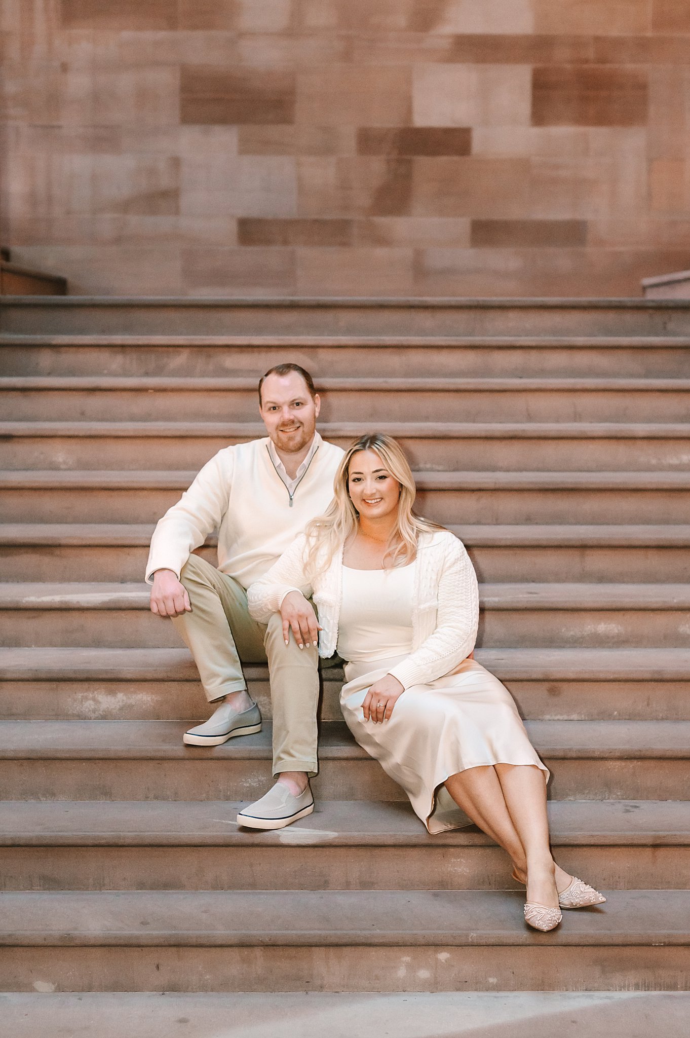 Bride and groom portrait sitting on the million dollar staircase