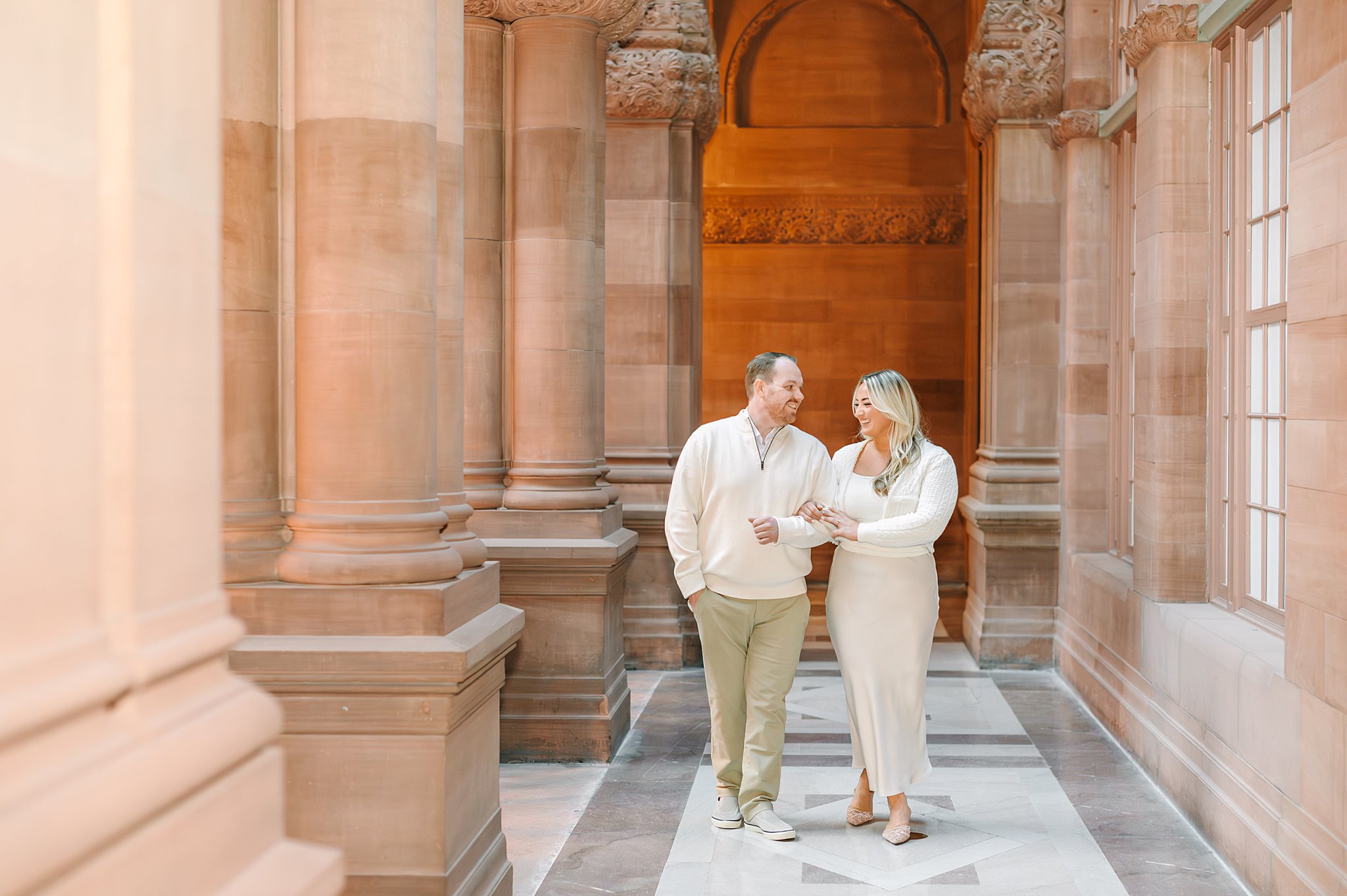 Bride and groom walking arm and arm